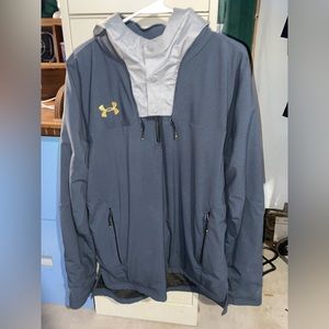 Under Armour Windbreaker, cold gear, hoodie is retractable into the collar.